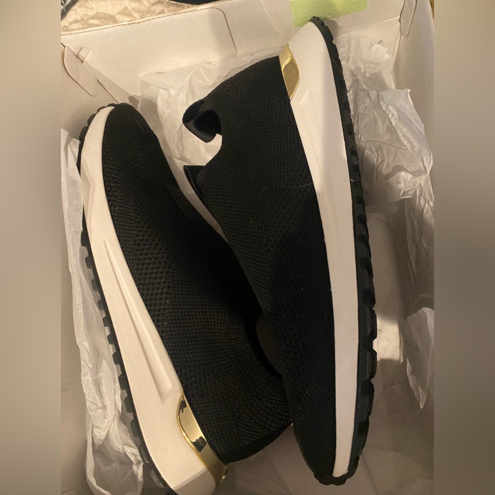 Michael Kors slip on sneaker small wedge. Super comfy.